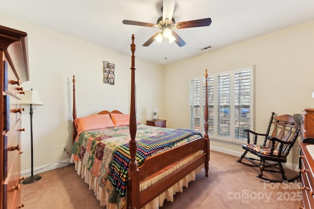 carpeted bedroom with multiple windows and ceiling fan