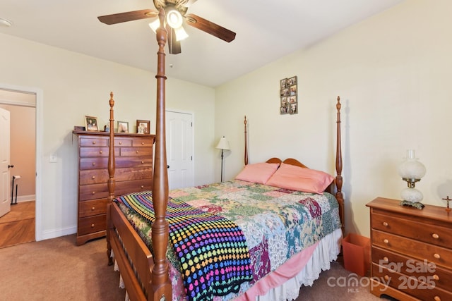 carpeted bedroom with ceiling fan