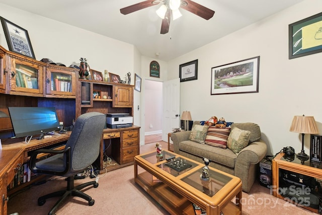 office featuring ceiling fan and light carpet