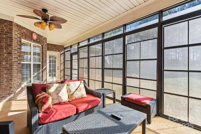 sunroom featuring ceiling fan