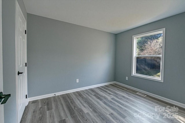 unfurnished room featuring light hardwood / wood-style flooring