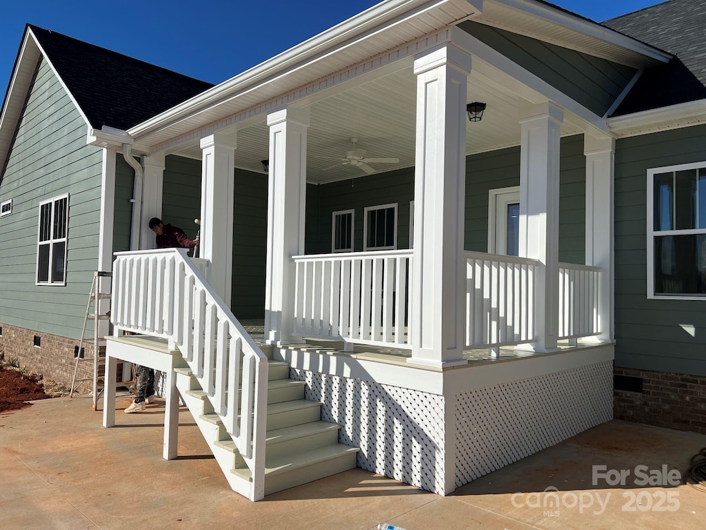 property entrance featuring a porch and ceiling fan