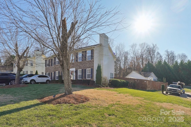 view of side of home featuring a yard