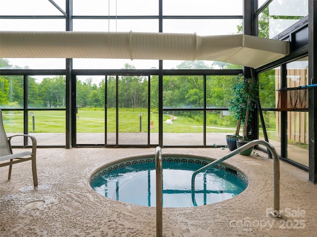 view of pool with an in ground hot tub