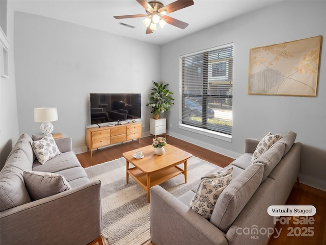 living room with hardwood / wood-style flooring and ceiling fan