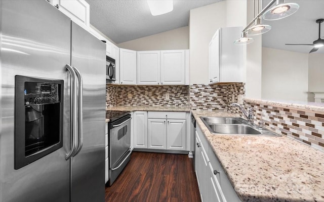 kitchen featuring dark hardwood / wood-style flooring, stainless steel appliances, sink, white cabinetry, and lofted ceiling