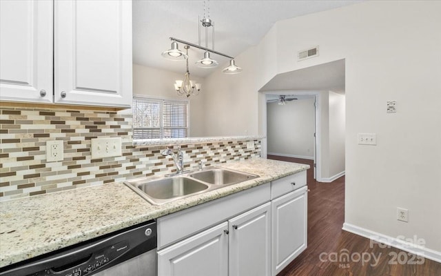 kitchen with dishwasher, ceiling fan with notable chandelier, sink, decorative backsplash, and white cabinetry