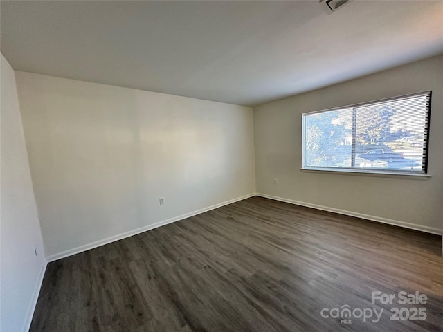 empty room featuring dark hardwood / wood-style floors