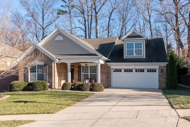 view of front of property with a front lawn and a garage