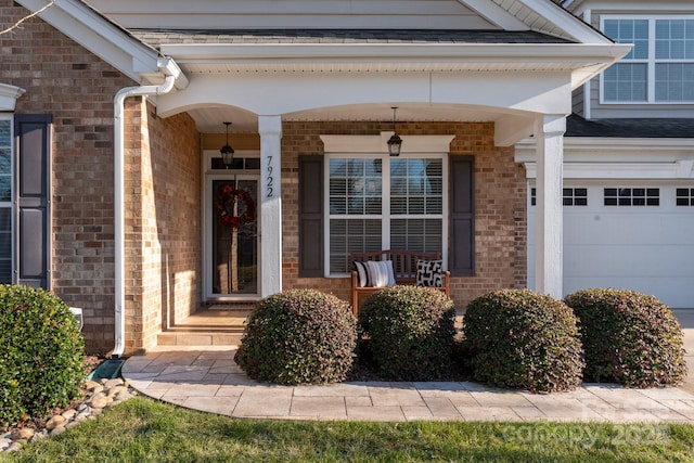 property entrance with covered porch, a garage, and central AC