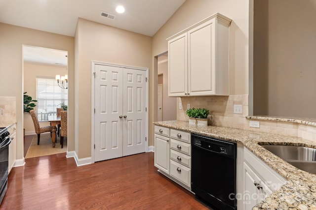 kitchen with white cabinetry, decorative backsplash, and dishwasher