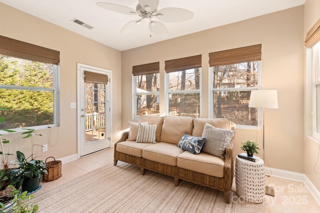 sunroom / solarium with ceiling fan