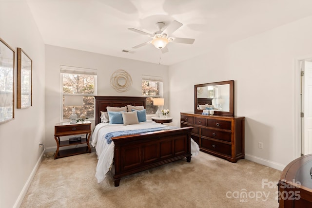 bedroom with ceiling fan and light colored carpet