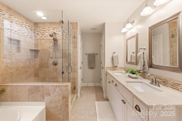 bathroom featuring vanity, separate shower and tub, and tile patterned flooring