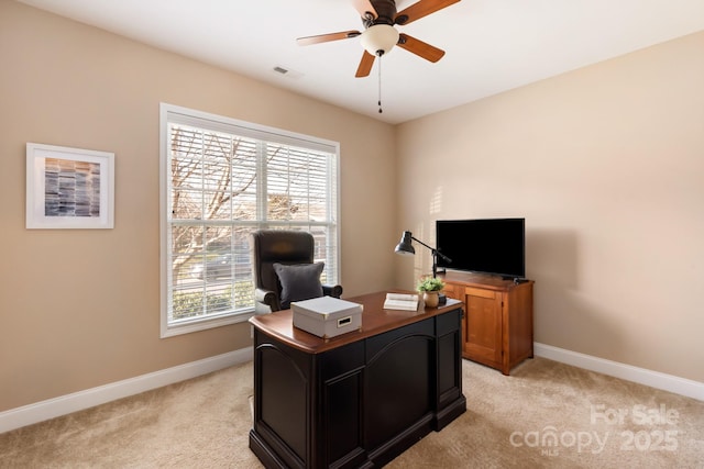 office area with ceiling fan, a healthy amount of sunlight, and light colored carpet