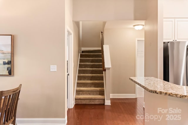 staircase featuring hardwood / wood-style flooring