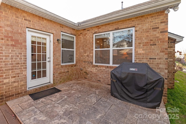 view of patio featuring a grill