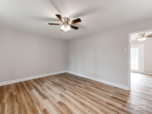 spare room featuring ceiling fan and light wood-type flooring