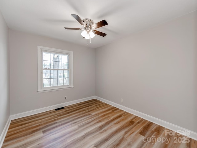 unfurnished room featuring ceiling fan and light hardwood / wood-style flooring