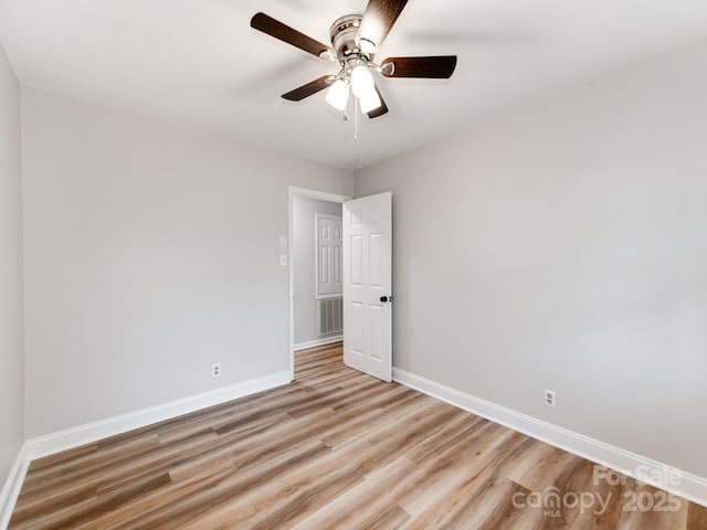 spare room with ceiling fan and light hardwood / wood-style floors