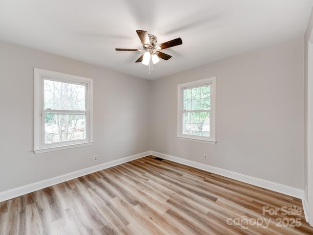 unfurnished room featuring ceiling fan and light hardwood / wood-style flooring