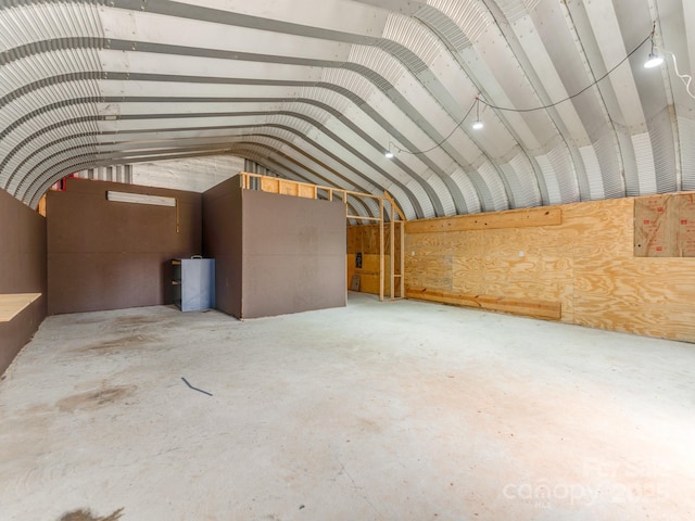 interior space with lofted ceiling and concrete floors