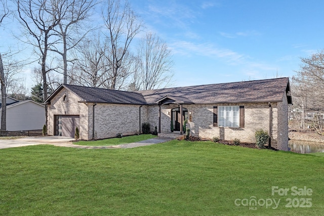 ranch-style home with a front yard and a garage