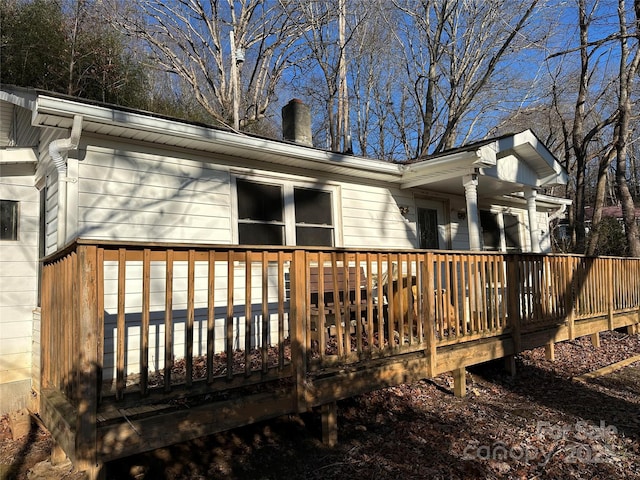 view of side of home featuring a deck