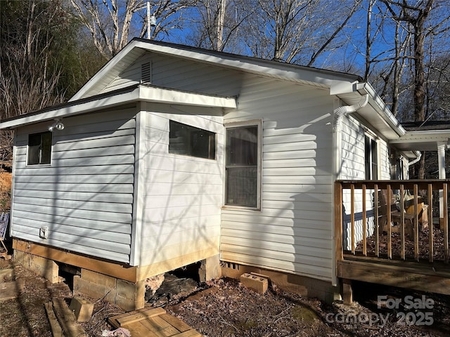 view of side of home featuring a deck