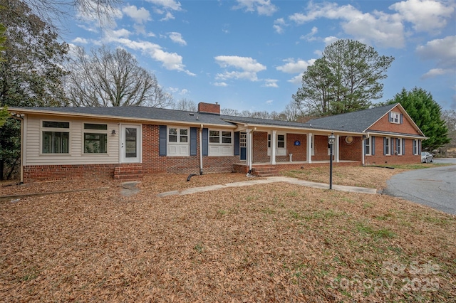 ranch-style house with covered porch