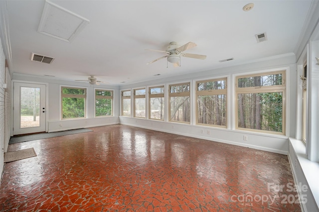 unfurnished sunroom featuring ceiling fan