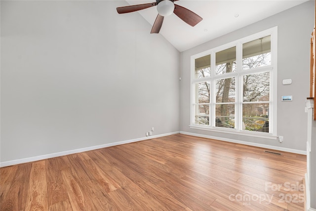 unfurnished room featuring light wood-type flooring, vaulted ceiling, and ceiling fan