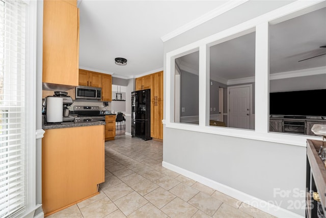 kitchen with light tile patterned floors, stainless steel appliances, ceiling fan, and crown molding