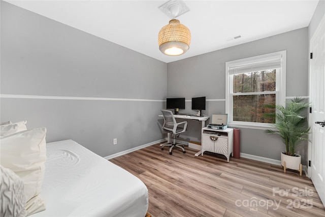 bedroom with light hardwood / wood-style flooring