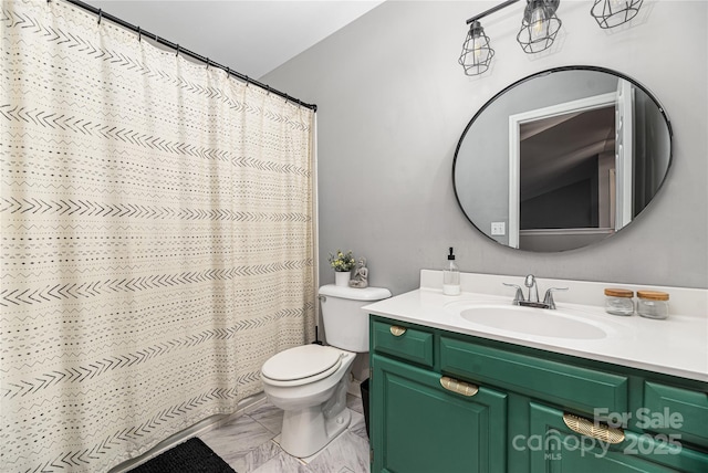 bathroom featuring vanity, toilet, and curtained shower