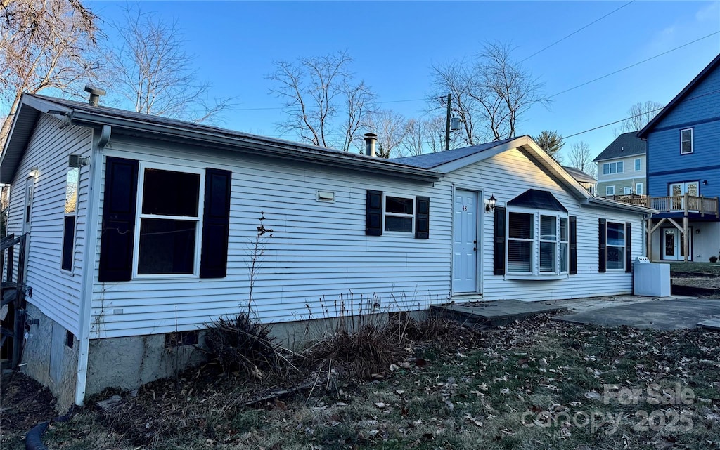 back of property with a patio area