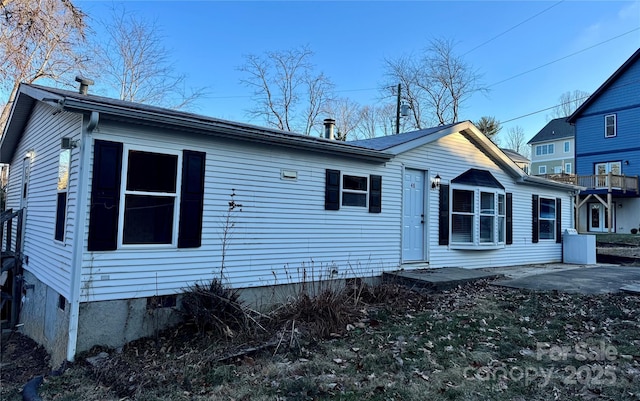 back of property with a patio area