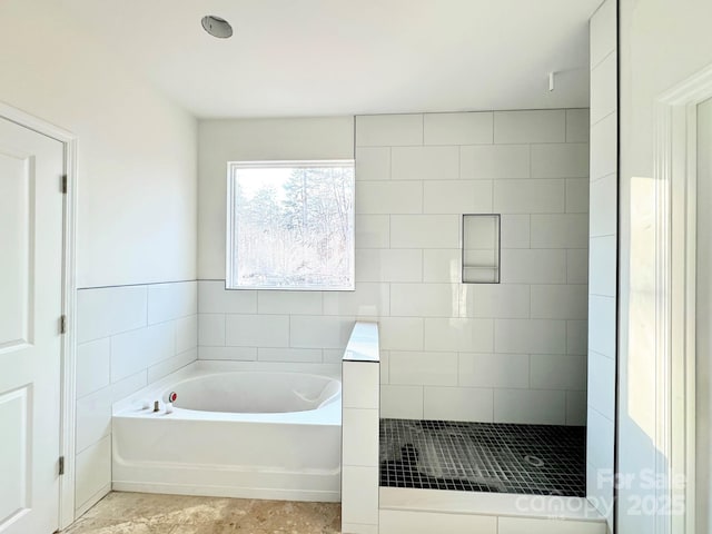 bathroom with separate shower and tub