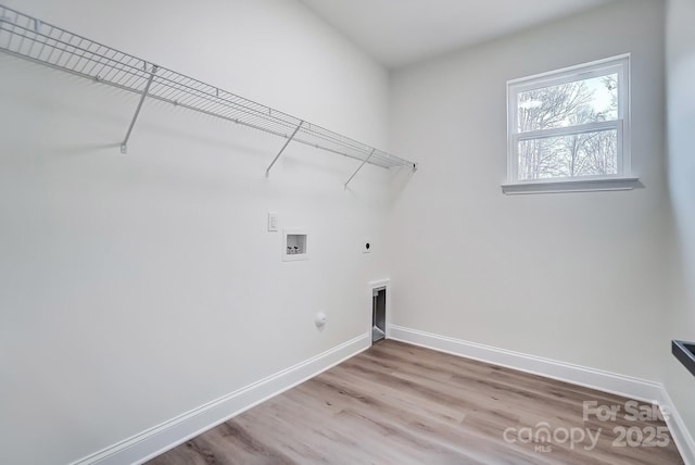 laundry room with baseboards, laundry area, washer hookup, and hookup for a gas dryer