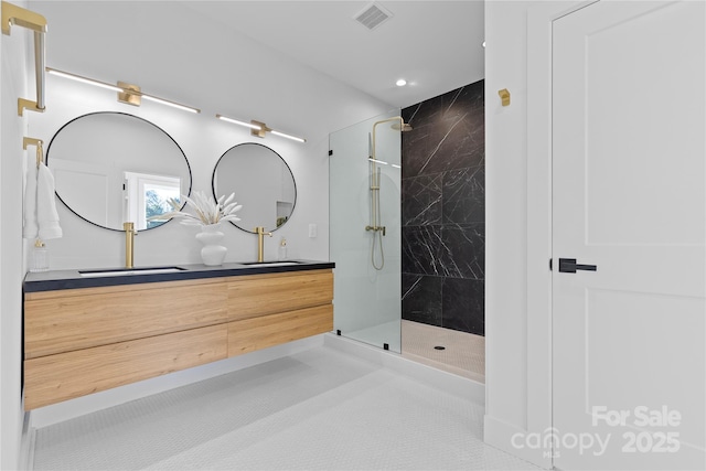 bathroom featuring vanity and a tile shower