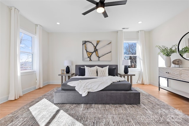 bedroom featuring recessed lighting, visible vents, baseboards, and light wood-style floors