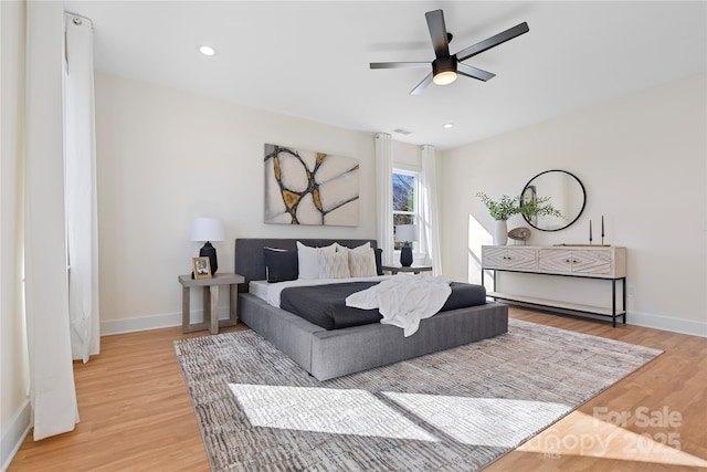 bedroom featuring visible vents, recessed lighting, light wood-type flooring, and baseboards