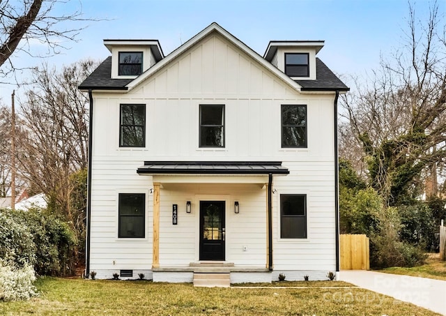 modern farmhouse style home featuring a standing seam roof, roof with shingles, board and batten siding, a front yard, and crawl space