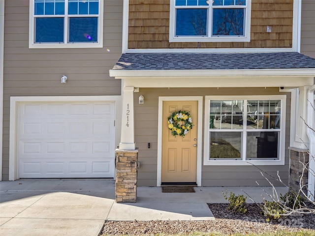 view of exterior entry featuring a garage