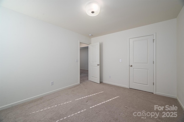 unfurnished bedroom featuring light colored carpet