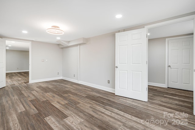 basement with dark wood-type flooring