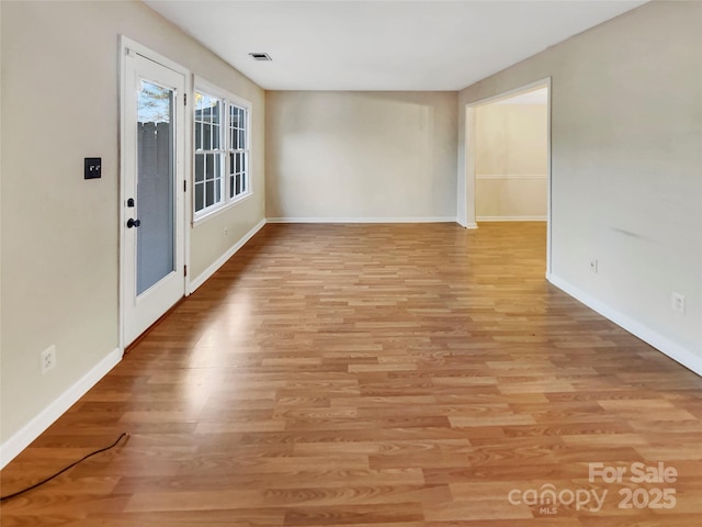 empty room with light wood-type flooring