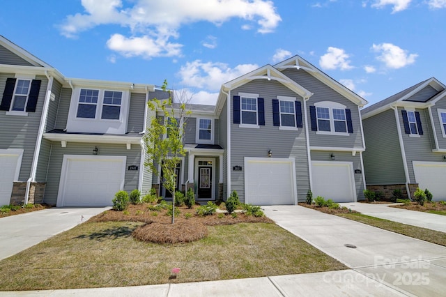 view of front of house featuring a garage and a front lawn