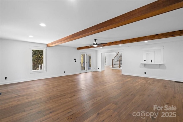 unfurnished living room featuring beam ceiling, wood-type flooring, french doors, and ceiling fan