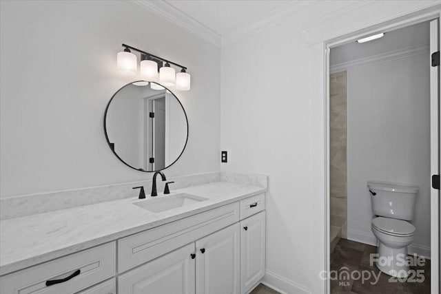 bathroom with vanity, crown molding, and toilet